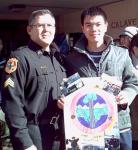 Jack Wei shows the poster he made for Sgt. Seawell.