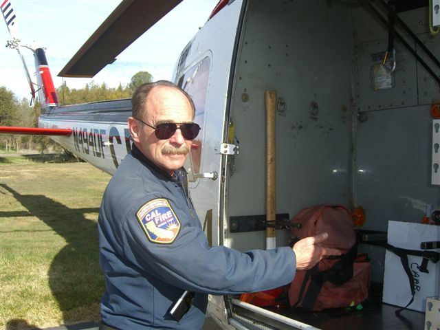Pilot Tom Eggleston showing pumps used to fill Air Tankers with Fire Retardant Mixture